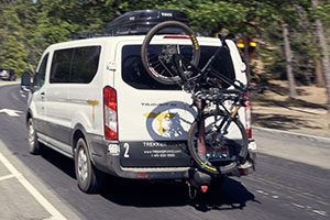a van with a bicycle on the back of it.