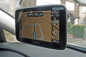 a gps device on the dashboard of a car.