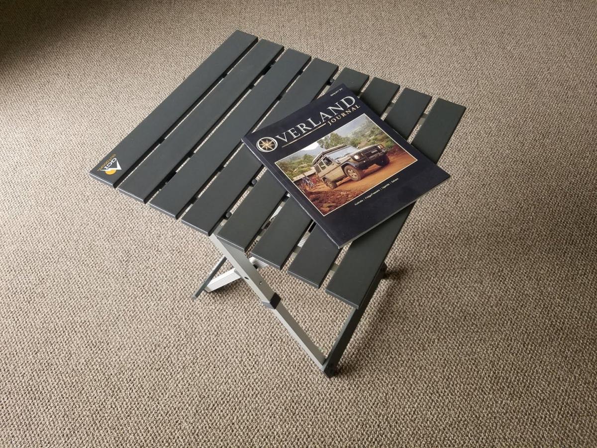 a folding table with a book on it.
