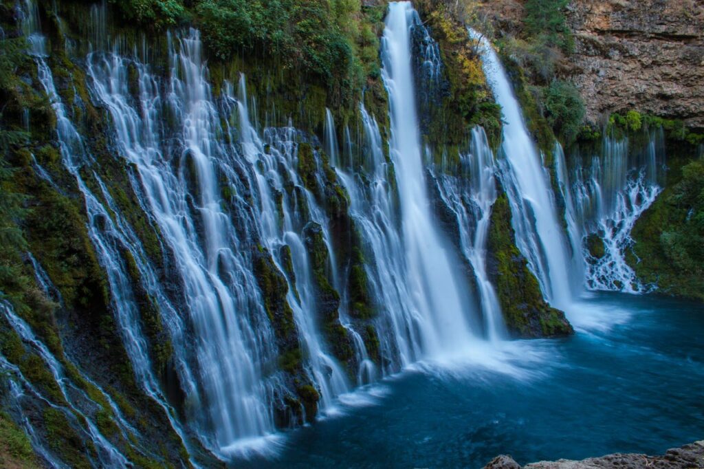 A waterfall in the middle of a rocky area.